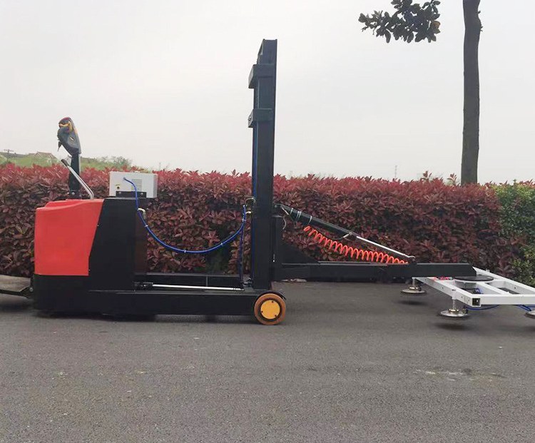 Side view of the reach forklift with the vacuum cup frame