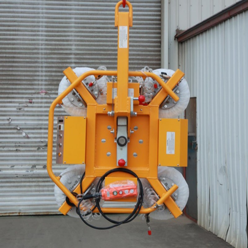 Front view of the X-frame lifter with the control cabinets and emergency stop