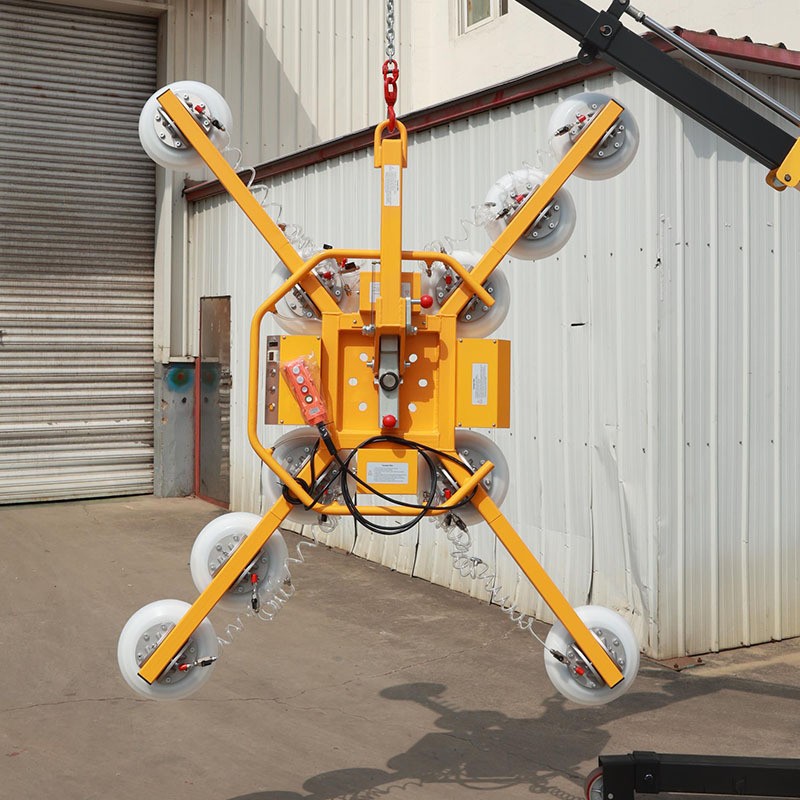X-type suction cup lifter suspended from a crane hook
